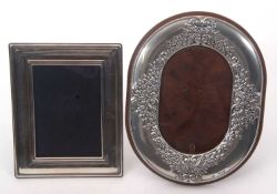 Mixed Lot: An oval shaped photograph frame decorated with a border of scrolls etc, easel backed