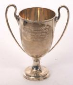 A George V silver twin handled trophy cup, presentation engraved 