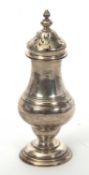 An Edwardian silver caster of plain baluster form, the body with reeded decoration, pull-off