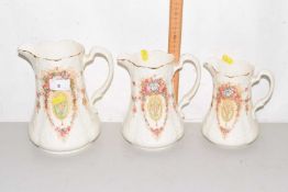 A graduated set of three Devon ware jugs