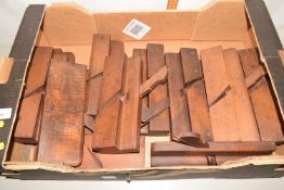 Box of wooden moulding planes