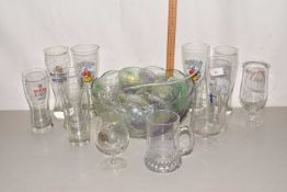 A glass punch set and a quantity of beer glasses