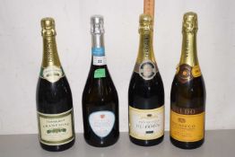 Four bottles of champagne and sparkling wine