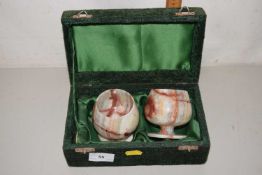 A pair of polished onyx goblets in case