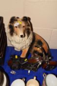 Porcelain model of a dog together with a model motorbike