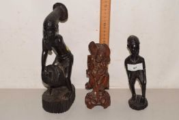 Group of three carved hardwood figures