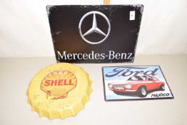 Three reproduction auto related metal signs, Shell Oil, Ford Escort and Mercedes Benz