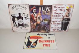 Four various reproduction metal Guinness and other drink related signs