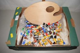 An artists palette and quantity of paints