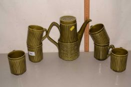 Quantity of green coffee cups and pot