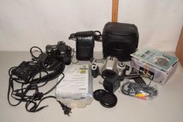 Quantity of assorted cameras to include Nikon Coolpix, Canon Rebel 2000 and others