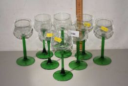 Set of eight green stemmed wine glasses