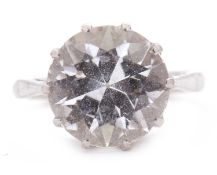 A white topaz ring, the round modified brilliant cut white topaz, approx. 11.5mm diameter, claw