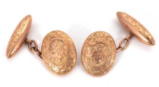 A pair of 10ct cufflinks, the oval and torpedo link cufflinks with engraved decoration, both stamped