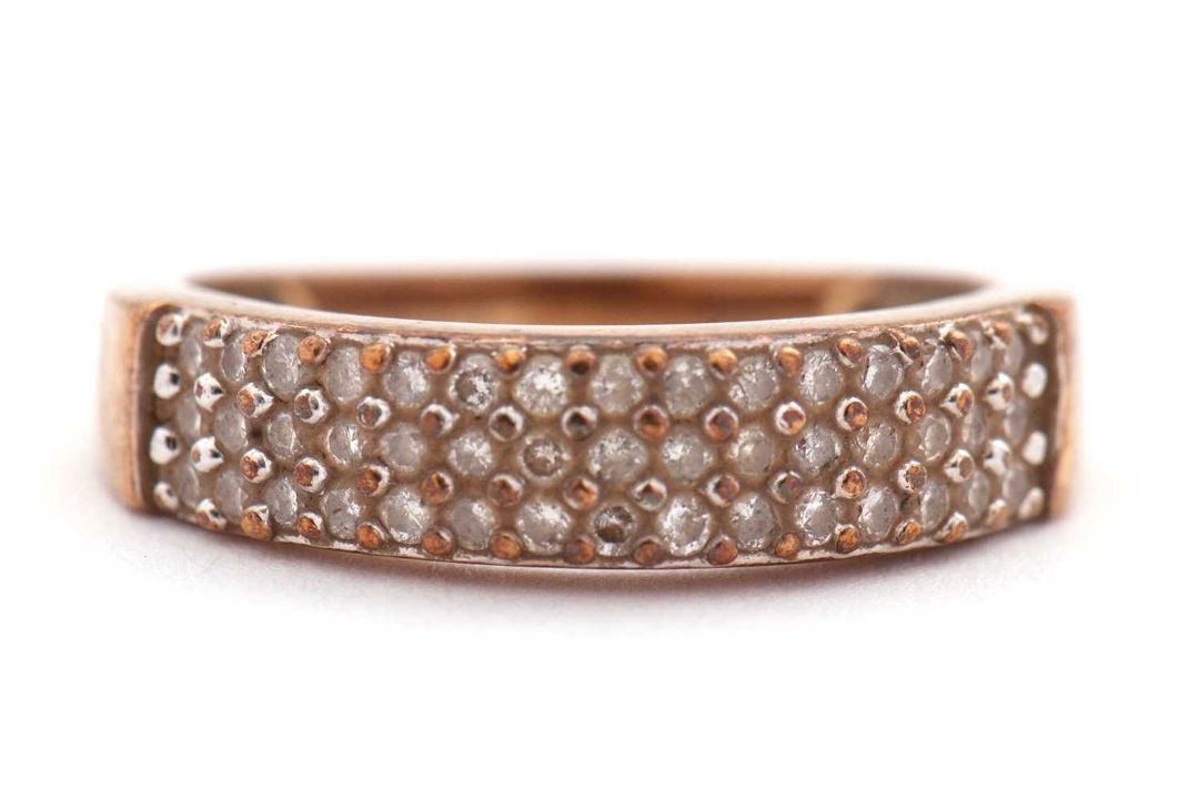 A diamond ring, set with three rows of small round brilliant cut diamonds, total estimated approx. - Image 6 of 6