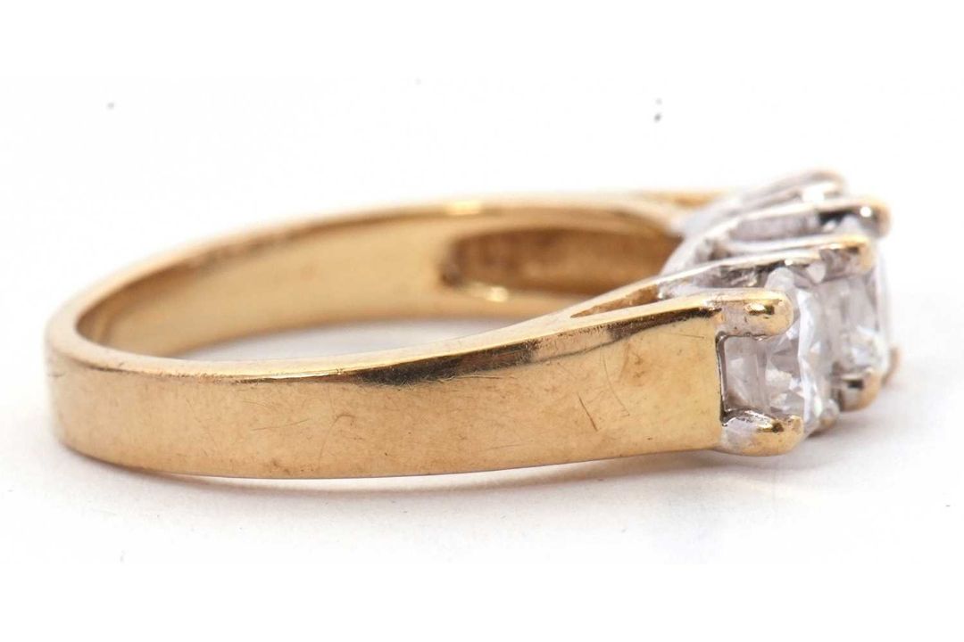 A 9ct CZ ring, the three round CZ's with tapering shoulders and plain band stamped 375 with - Image 3 of 8
