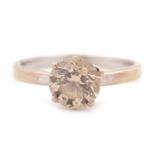 An 18ct champagne diamond solitaire ring, the round brilliant cut diamond, estimated approx. 1.