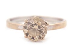 An 18ct champagne diamond solitaire ring, the round brilliant cut diamond, estimated approx. 1.