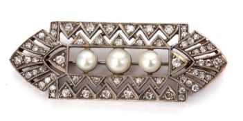 An Art Deco diamond brooch, set to centre with three 'pearls', with an outer open frame with zig-zag