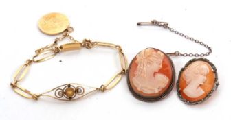 A gemset bracelet, set with a citrine and two faux pearls, in navette shaped frame with fancy link