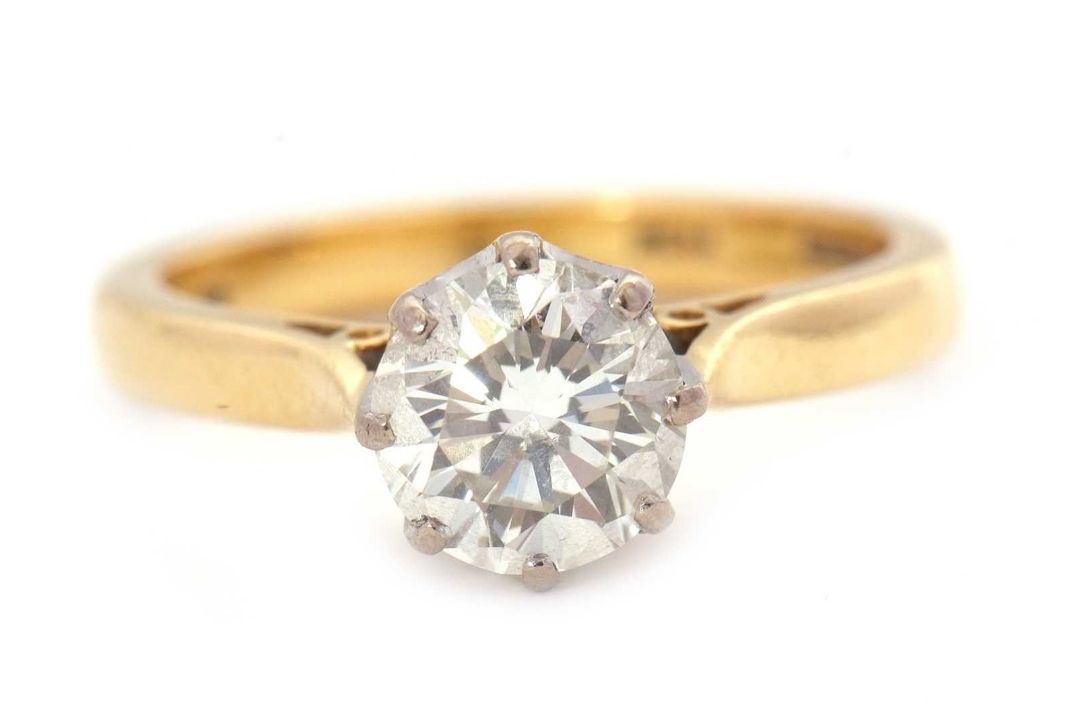 An 18ct diamond solitaire ring, the round brilliant cut dimaond, estimated approx. 1.29cts, colour - Image 1 of 7