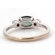 A 9ct sapphire and diamond ring, the oval blue-green sapphire set to either side with a round - Image 5 of 8