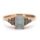 A 9ct aquamarine ring, set with an emerald cut aquamarine and three small round aquamarines to - Image 1 of 8