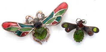 Two insect brooches: the first set with garnets and green stones, in unmarked white metal (tests
