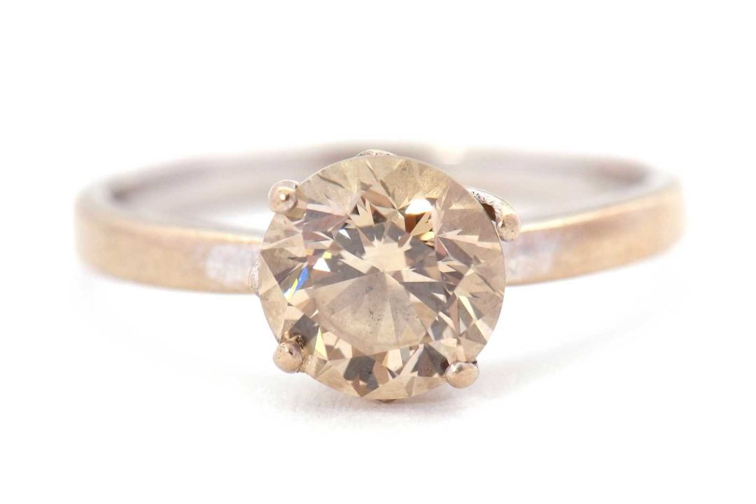 An 18ct champagne diamond solitaire ring, the round brilliant cut diamond, estimated approx. 1. - Image 8 of 9