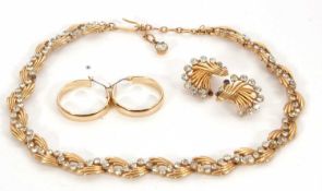 A Trifari necklace and matching earrings, the necklace of fluted gilt metal links with an undulating
