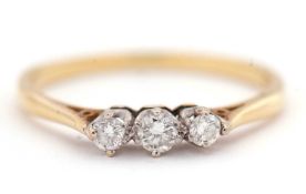 An 18ct three stone diamond ring, the three round brilliant cut diamonds, total estimated approx.