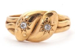 An 18ct diamond snake ring, the double headed serpent with a gypsy set old mine cut diamond to
