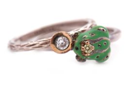 Two silver rings by 'Daisy': to include an enamel frog ring set with a pale yellow stone, stamped '