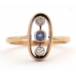 A sapphire and diamond ring, the oval frame with two collet mounted old mine cut diamonds and a