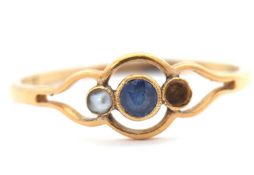 A sapphire and cultured pearl ring, the central round sapphire with a split cultured pearl with