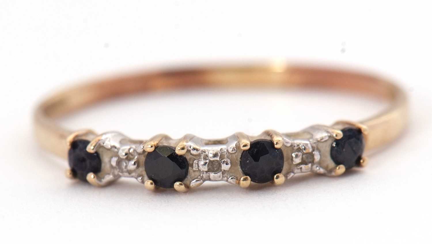 A sapphire and diamond ring, the alternating round sapphires interspaced with diamond hightlights, - Image 2 of 5