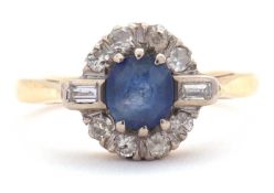 A sapphire and diamond ring, the central round sapphire surrounded by single cut diamonds and a