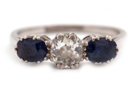 A three stone sapphire and diamond ring, the central old mine cut diamond, estimated approx. 0.