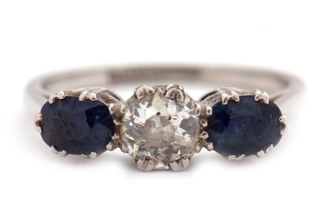 A three stone sapphire and diamond ring, the central old mine cut diamond, estimated approx. 0. - Image 1 of 9