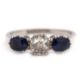 A three stone sapphire and diamond ring, the central old mine cut diamond, estimated approx. 0. - Image 1 of 9