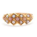 A late Victorian 15ct seed pearl and coral ring, with four round coral cabochons and seed pearls