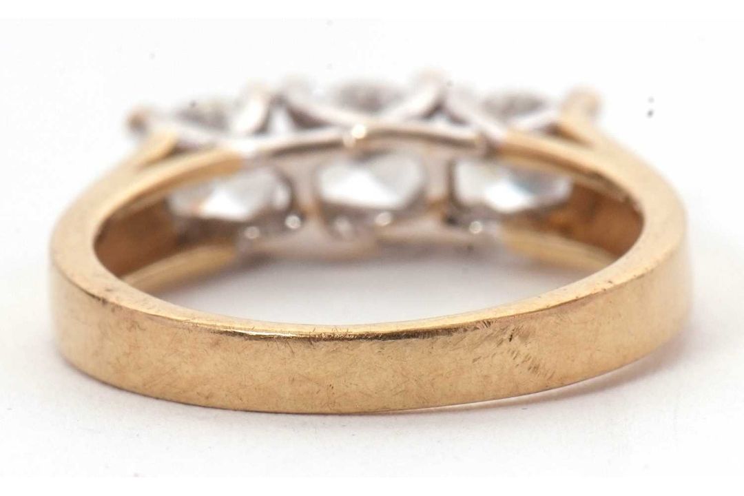 A 9ct CZ ring, the three round CZ's with tapering shoulders and plain band stamped 375 with - Image 4 of 8