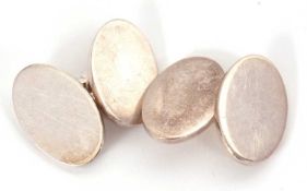 A pair of silver cufflinks by Links of London, the plain oval discs, 22mm long, with links