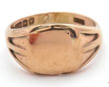 A 9ct signet ring, the central plain square panel, with tapered shoulders and plain band