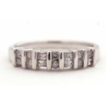 A 14K diamond ring, alternatively set with two baguette and two round brilliant cut diamonds,