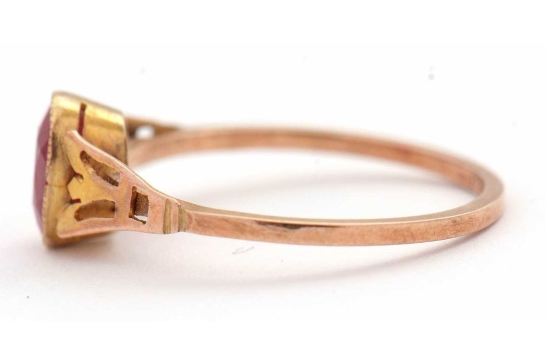 A synthetic ruby ring, the oval synthetic ruby with tapered shoulders and plain band stamped 9ct, - Image 7 of 8