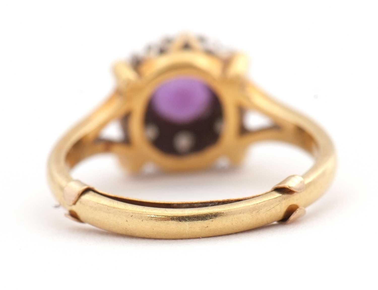 An 18ct amethyst and diamond ring, the central round amethyst surrounded by single cut diamonds, - Image 3 of 7