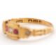 An Edwardian 18ct ruby and diamond ring, set with a central round diamond and a round ruby to either - Image 2 of 7