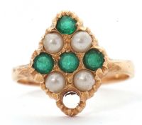 A gemset ring, set with green stones and faux pearls, all set in unmarked yellow metal (tests as