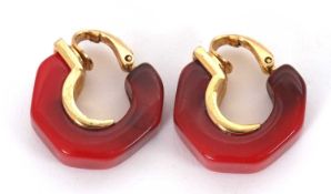 A pair of Givenchy earrings, the cherry amber colour plastic hoops, 6mm thick, with gilt metal